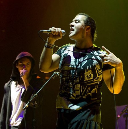 Paulo Goude with his band member, Faisal singing on the stage
